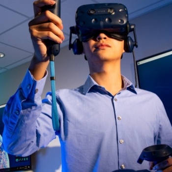 person using VR to look at 3D image of human heart