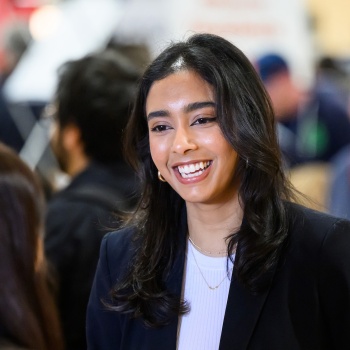 woman smiling with another woman