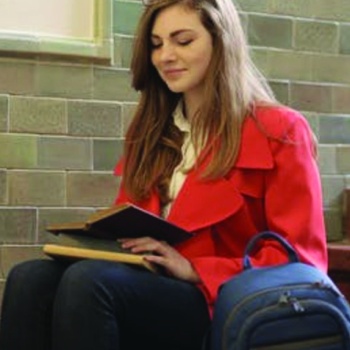 student-reading-a-book-on-stairs