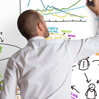 Man writing on Dry-Erase board