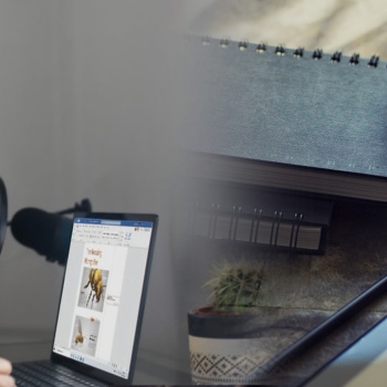 someone-looking-at-a-laptop-and-taking-notes