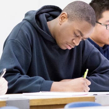 Students at desks taking an exam