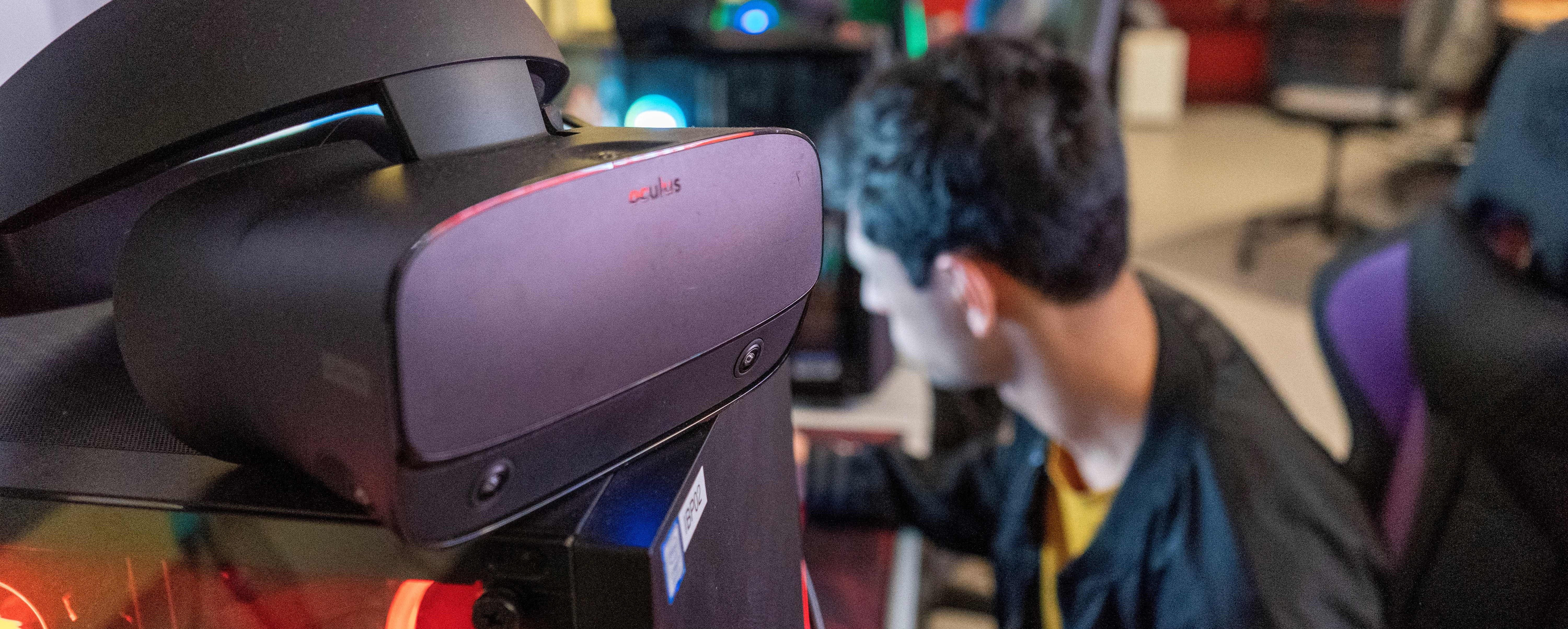 VR headset next to student at a computer