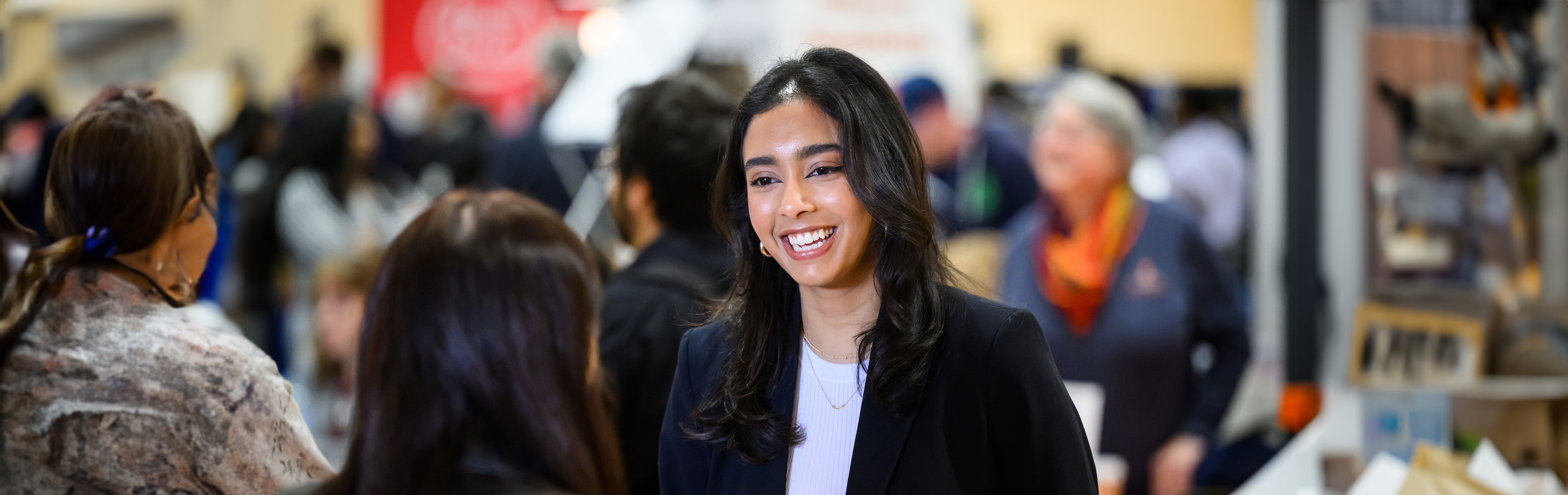 woman smiling with another woman