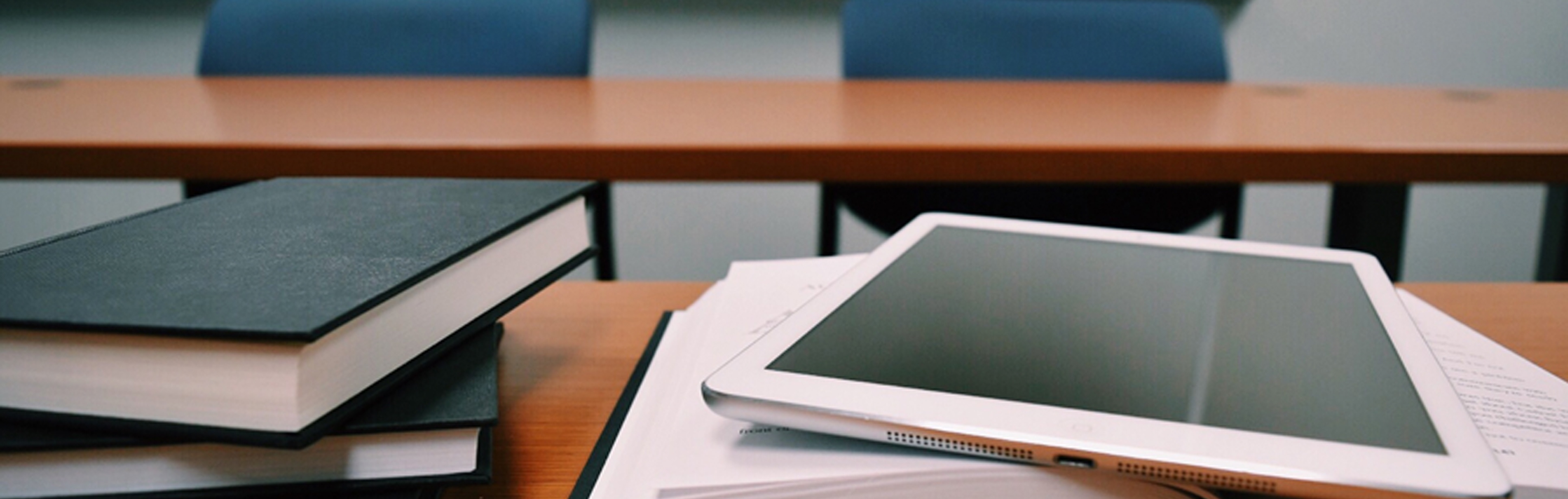 desk with tablet and books 